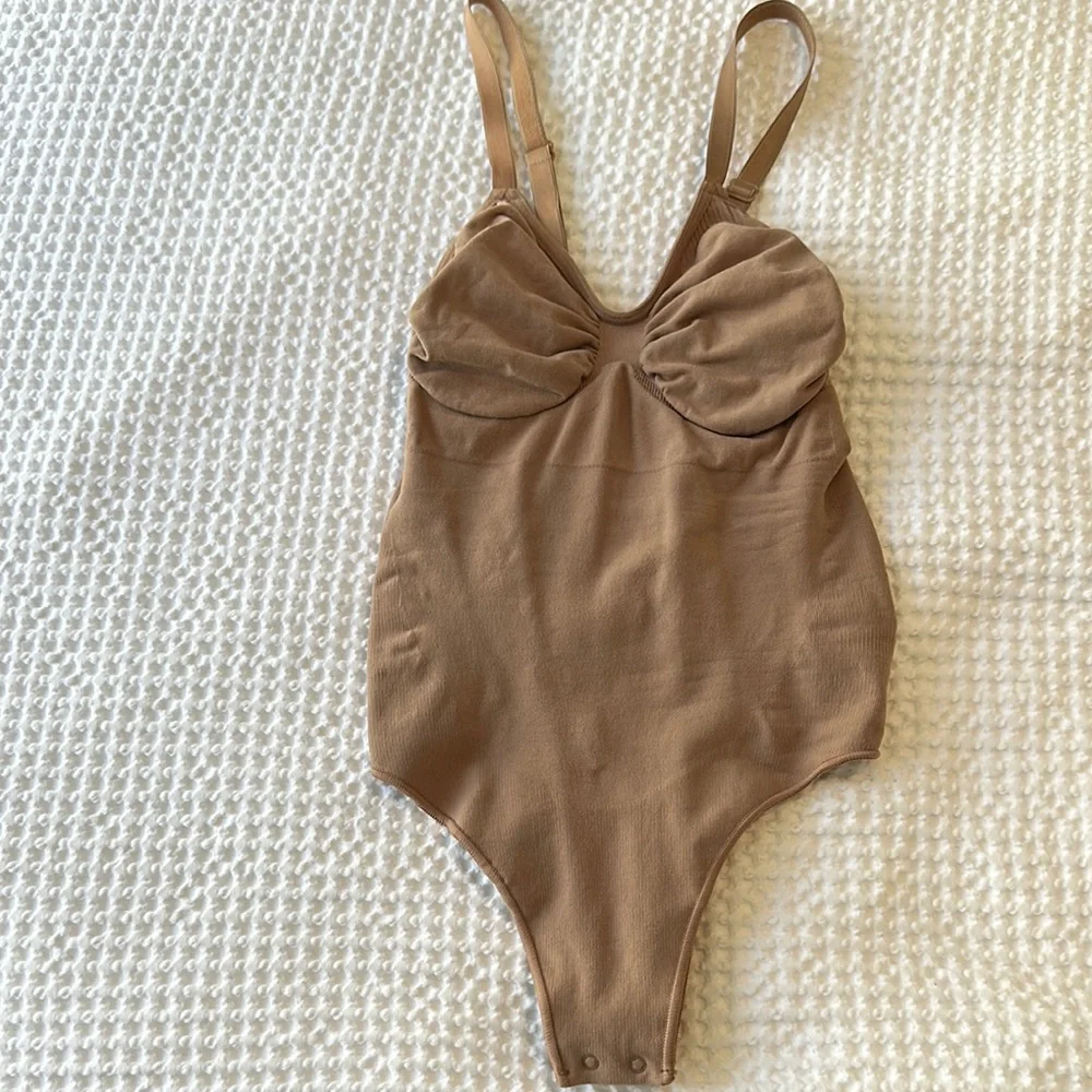 SKIMS Tan Bodysuit with Ruched Front and Halter Straps - Picture 1 of 2